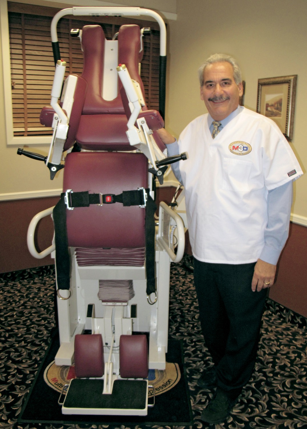 Dr. David Cuccia beside the Extentrac Elite decompression system